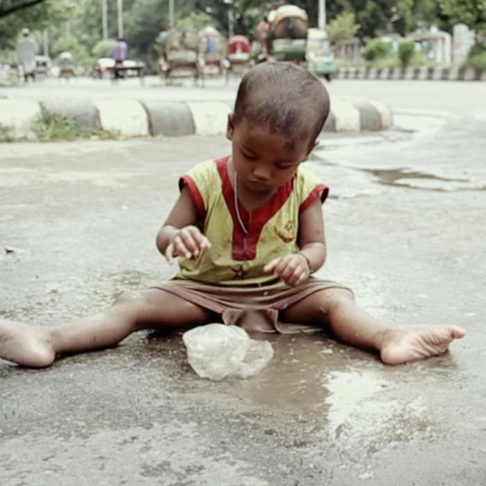 Sponsored girl washes her hands with water pump in Myanmar paid for with ActionAid child sponsorship