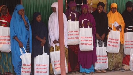 Women collect sanitary towels as part of our dignity kit distribution.