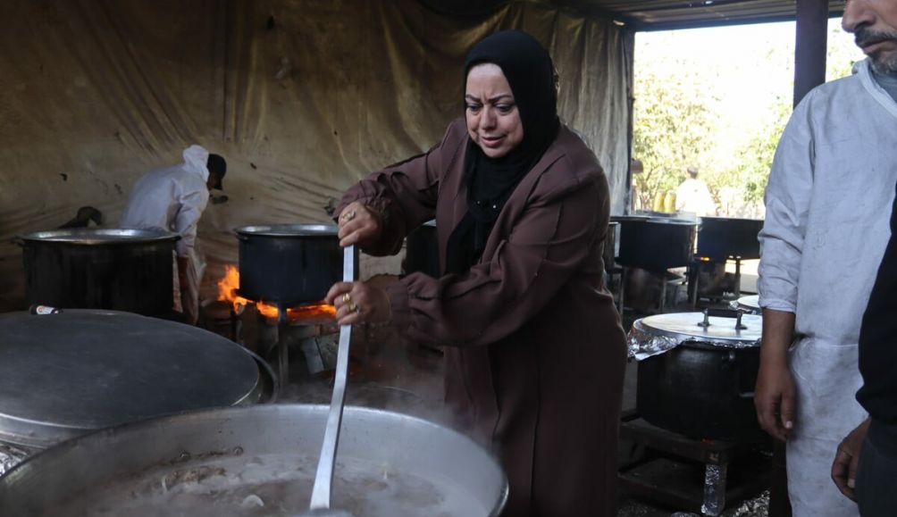 Members of an ActionAid partner organisation, the Women and Child Care Association (WEFAQ), distributing food in Gaza.