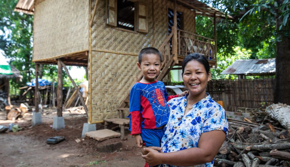 U Phyo Wai Lin and Ma Mar Aye in front of their new home in Mandalay Region. 