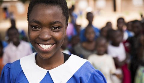 Vast, aged 17, at her school in Malawi