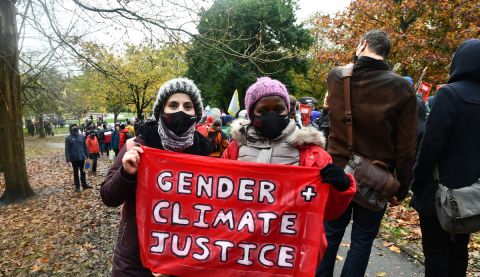 Climate activists Monicah Kamandau from Kenya and Safa Almomani from Jordan at the Global Day of Action march in Glasgow