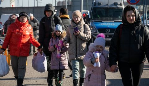 Displaced women and children arrive at Hrebenne, a crossing point on the Polish side of the Ukraine-Poland border where ActionAid and partner PAH are working