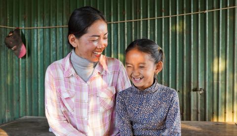 Hok (left) is a Women's Champion in Cambodia, helping her community become more resilient to climate change.