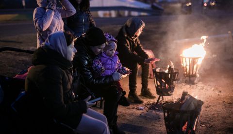 Ukrainian refugees at a crossing point on the Polish Ukraine border.