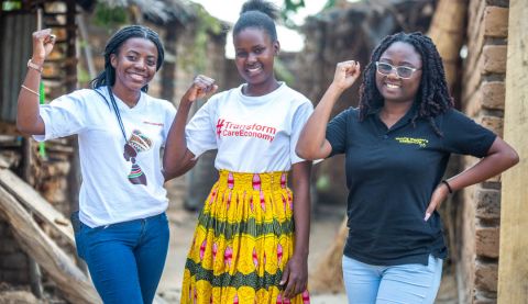 Eneless Hudson (centre), 25, is challenging austerity measures through the Mchinji Young Women Hub in Malawi.