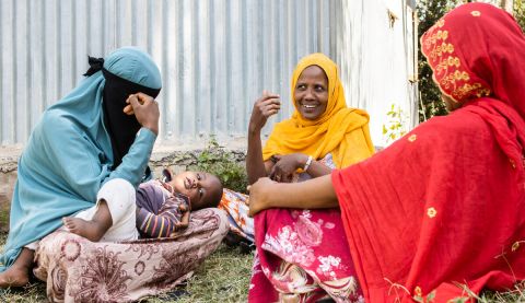 Women sitting in a circle and talking
