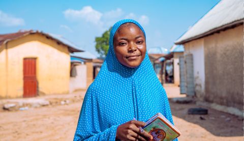 Girl holding a book in her hands