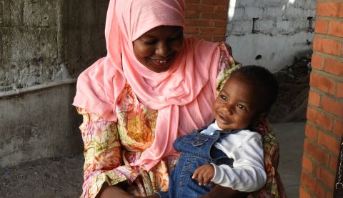 Haddy and her son Mohamed, from western Gambia. Mohamed has received life-saving vaccines thanks to one of ActionAid’s healthcare projects