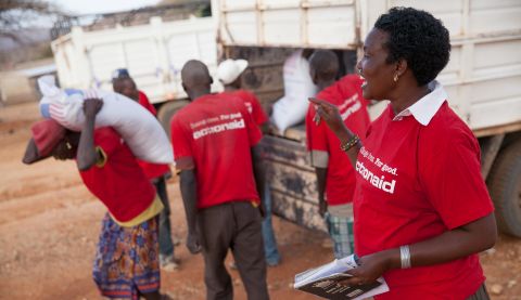 Woman leader Luijah directs an ActionAid food distribution for people suffering from drought in Kenya