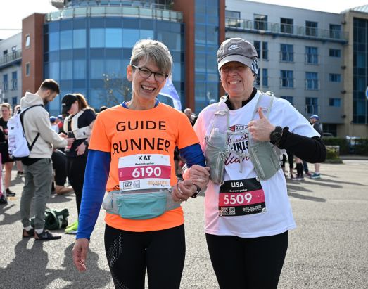 Ladies smile at Reading Half Marathon 2024.