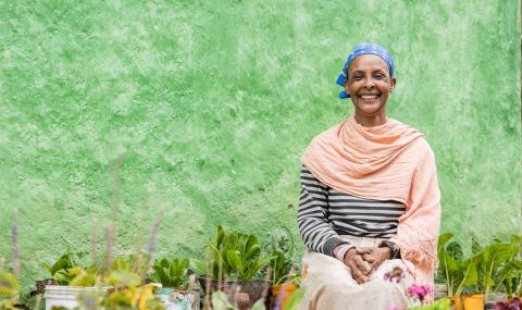 Woman sitting in her garden
