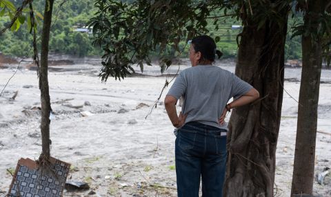 A woman surveying the floods damage in Nepal