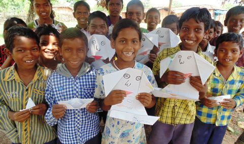 Nikita and friends learned origami at their ActionAid child sponsorship message collection in their village in India