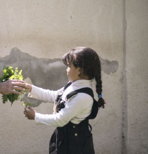 Six-year-old Maria helps out a local gardener at the ActionAid centre in Zarqa, Jordan. 