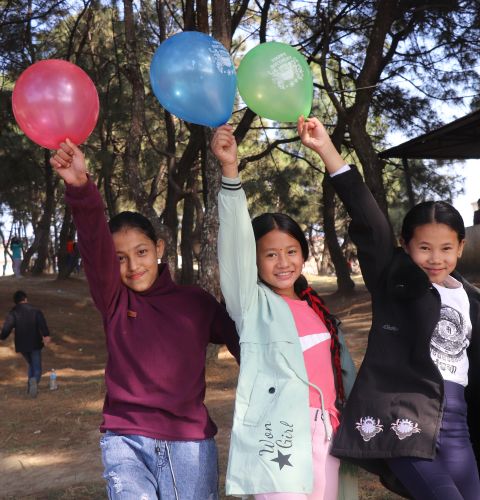 Samiksha (pictured middle) playing with friends in Kathmandu, Nepal