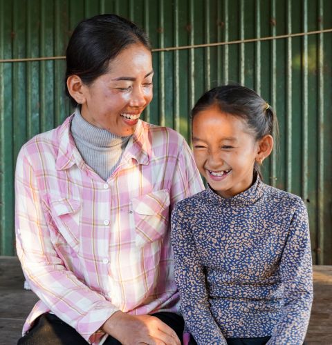 Hok (left) is a Women's Champion in Cambodia, helping her community become more resilient to climate change.