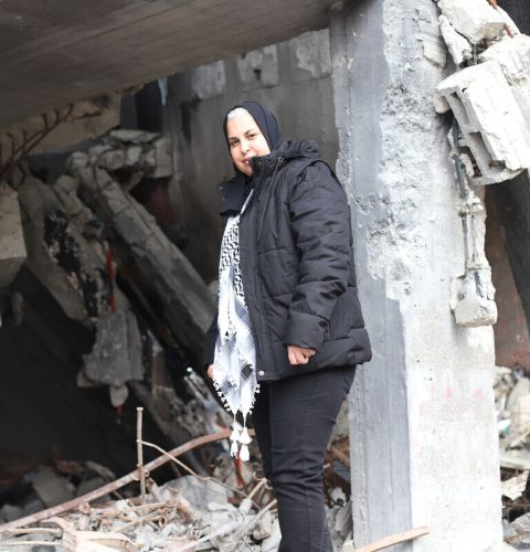 Sahar a humanitarian worker and head of the Palestinian Development Women Studies Association (PWDSA) returns to the organisation’s office in Gaza City, which has been completely destroyed