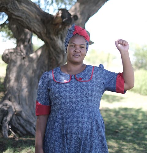 Woman holding up a fist in defiance