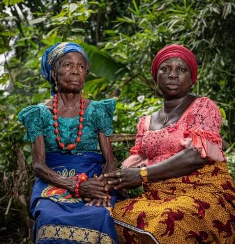 Two women looking into the camera and away