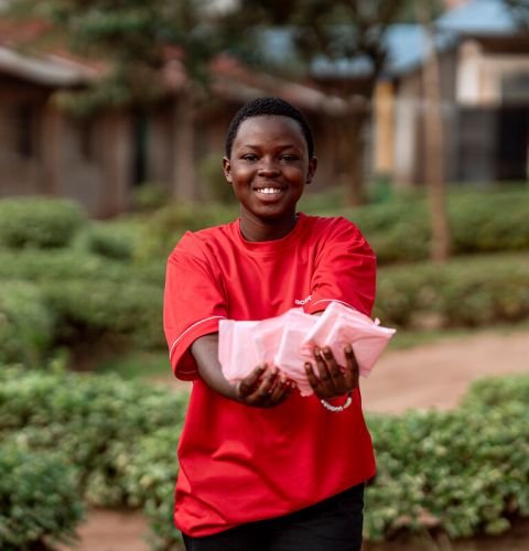Girl holding up period pads