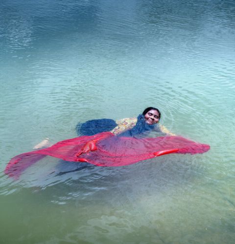 Woman floating in a lake