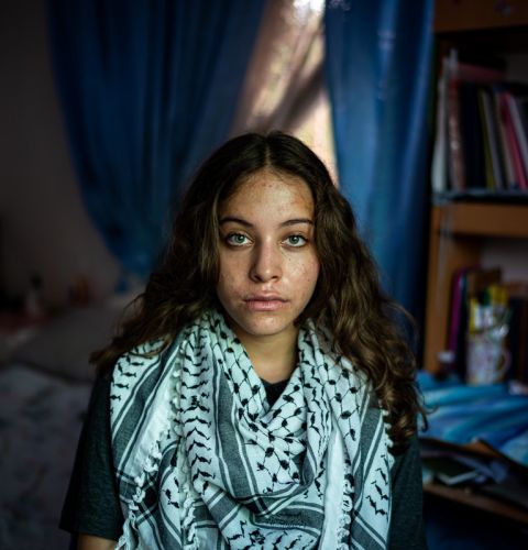 A young girl looking into camera