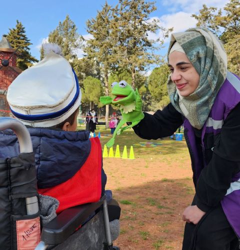 Ayat, a volunteer for Voilet, an ActionAid partner organisation, at a shelter providing psychosocial care to children and parents after the earthquake hit Syria in 2023.