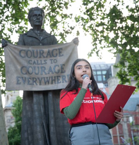 Community Campaigner, Ria, speaking at the People's Banquet