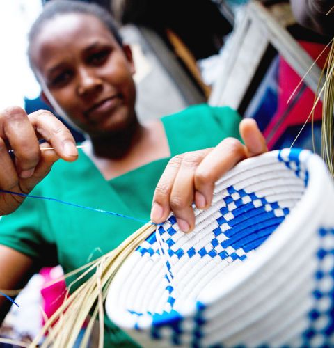 In Uganda Cossy, a survivor of violence, now works as a basket weaver, and does outreach in her community to support other survivors.