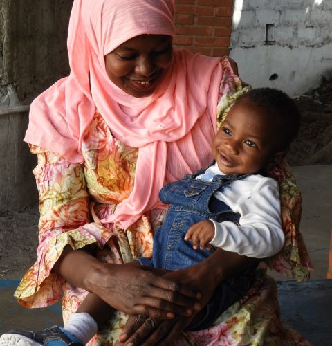 Haddy and her son Mohamed, from western Gambia. Mohamed has received life-saving vaccines thanks to one of ActionAid’s healthcare projects