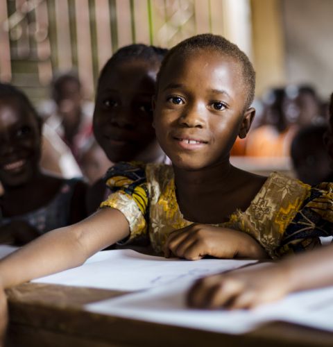 Six-year-old Mariama sits in class with her friends at her primary school, sponsored by ActionAid, in Sierra Leone