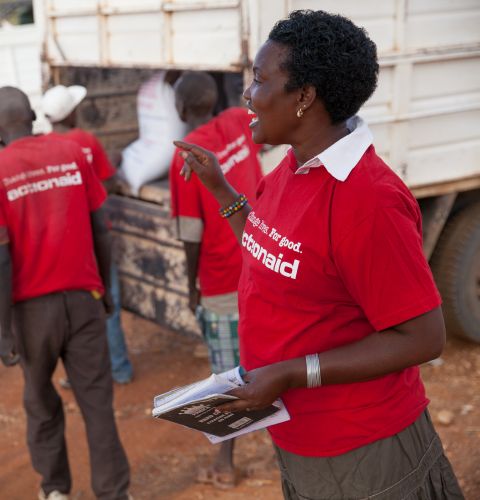 Woman leader Luijah directs an ActionAid food distribution for people suffering from drought in Kenya