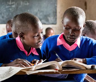 Students Abigail (R) and Purity (L) in class at school in West Pokot, Kenya.