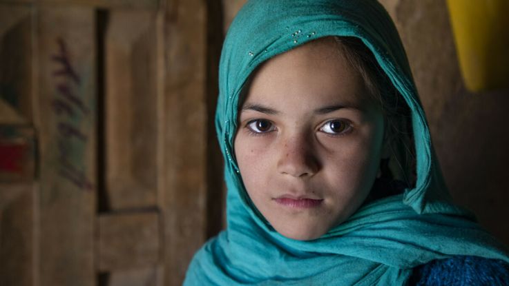 Haidah* (Laila's daughter) poses for a photograph in the family home in Afghanistan.