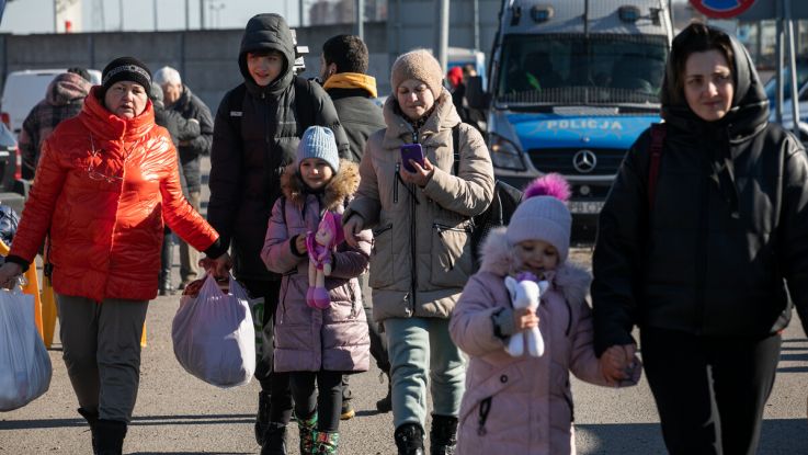 Displaced women and children arrive at Hrebenne, a crossing point on the Polish side of the Ukraine-Poland border where ActionAid and partner PAH are working