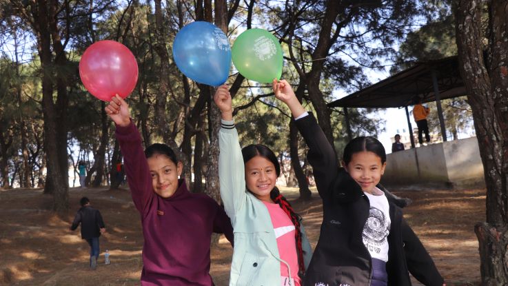 Samiksha (pictured middle) playing with friends in Kathmandu, Nepal