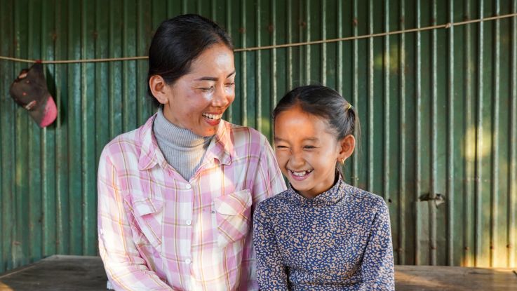 Hok (left) is a Women's Champion in Cambodia, helping her community become more resilient to climate change.