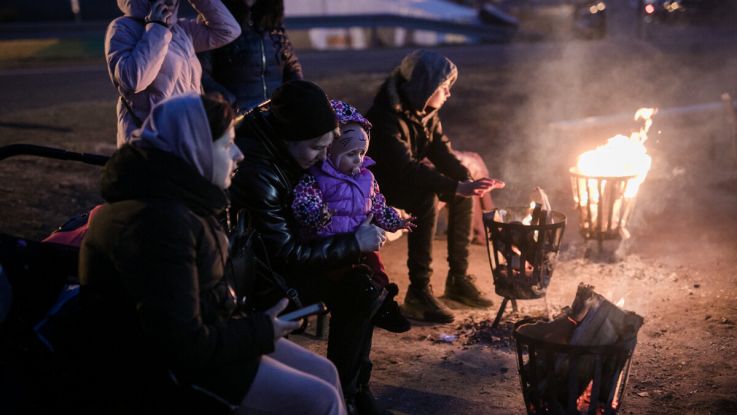 Ukrainian refugees at a crossing point on the Polish Ukraine border.
