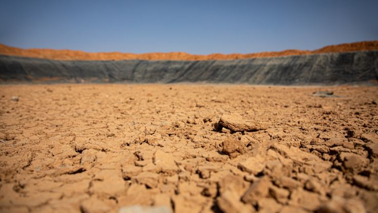 Once filled with over 150,000 barrels of water, this ActionAid-implemented earth dam in Beerato, Somaliland is now completely dry due to failed rains and increasing temperatures