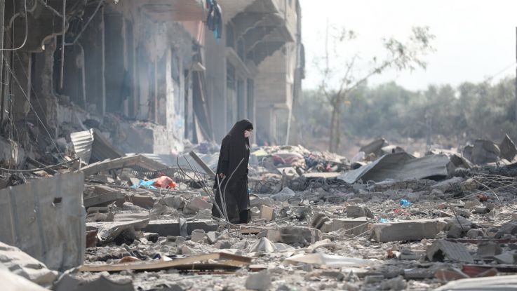 A woman resident of Gaza City searches the rubble for belongings in the aftermath of bombing by the Israeli army. 10th October 23