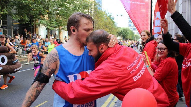 Family hug at marathon