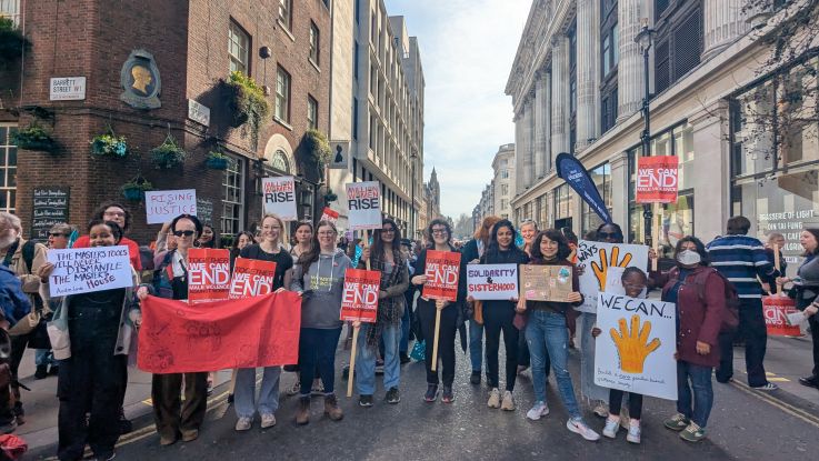 Community campaigners and staff at a women's rights march. 