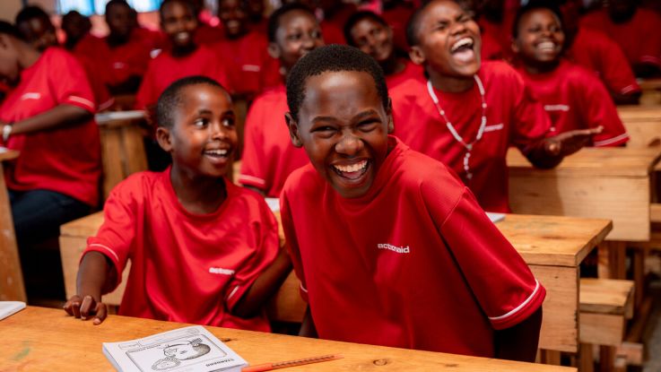Girls laughing in a classroom at a school in Rwanda