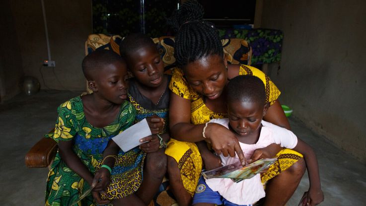 A family looking at old photos