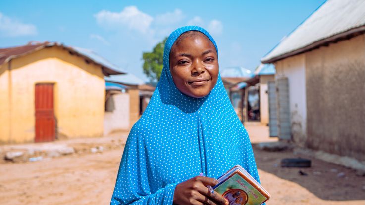 Girl holding a book in her hands