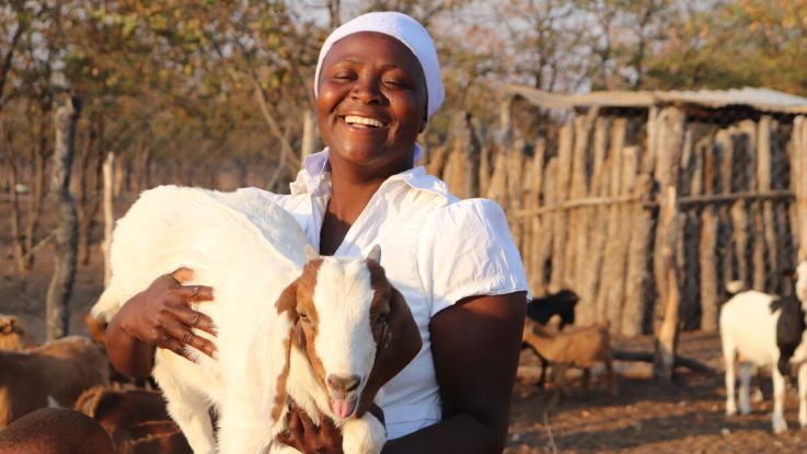 Woman holding a goat