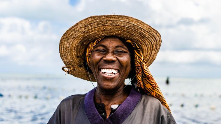 Fisherwoman looking at camera and laughing