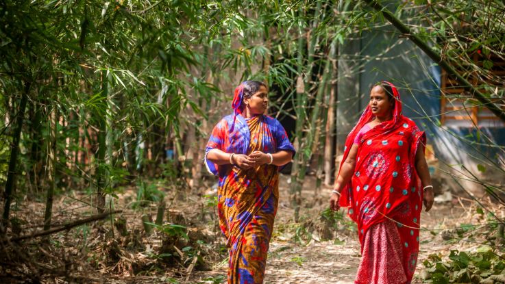 women walking and talking