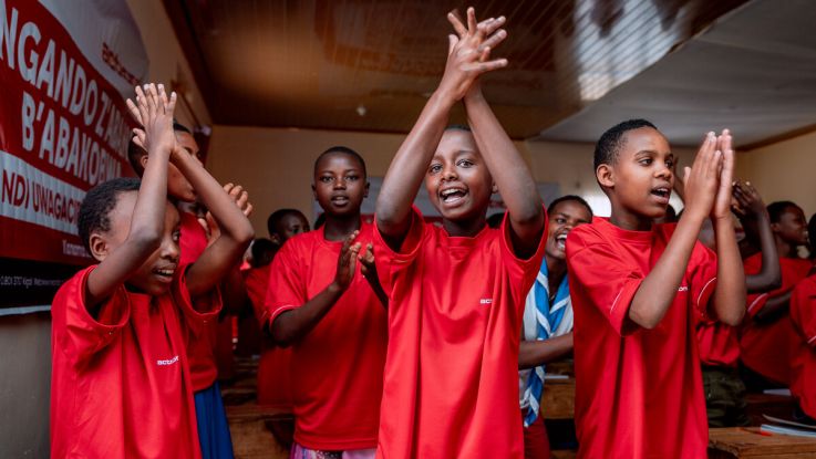 Girls clapping in a classroom